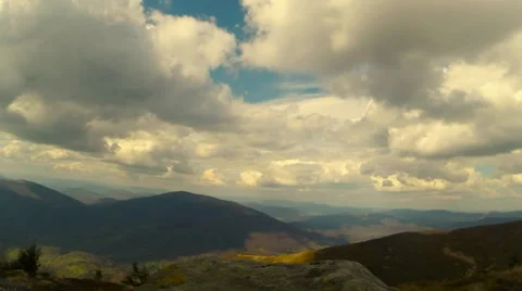 Floating clouds with tops of mountains timelaps Stock Footage 37559424