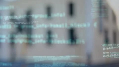 Floating code text overlay is hovering in flat design over facade with dark Foto stock