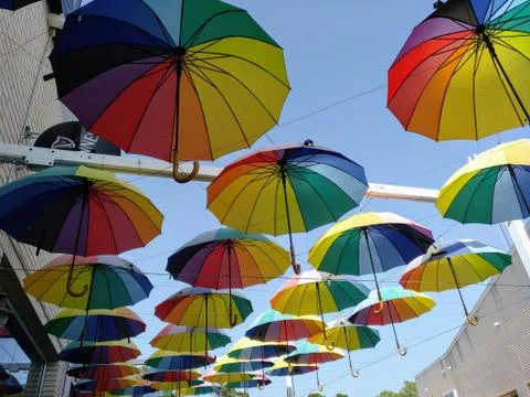 Floating colourful umbrellas Stock Photos