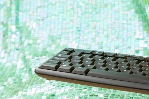Floating computer keyboard. Green white bokeh background. Copy space. Foto stock