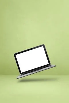 Floating computer laptop isolated on green. Vertical background Illustrazione stock