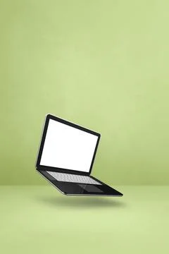 Floating computer laptop isolated on green. Vertical background Illustrazione stock