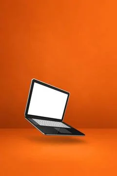Floating computer laptop isolated on orange. Vertical background Blank com... Stock Photos