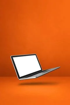 Floating computer laptop isolated on orange. Vertical background Blank com... Stock-Fotos