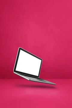 Floating computer laptop isolated on pink. Vertical background Blank compu... Stock Photos