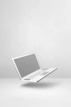 Floating computer laptop isolated on white. Vertical background Illustrazione stock