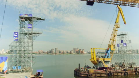 Floating crane constructing diving tower on river surface Stock Footage 236708859