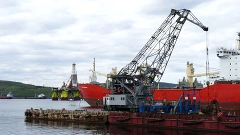 Floating crane, COSL drilling platform and ships in the Kola Bay. Stock Footage 80799870