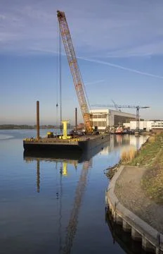 Floating crane in a river Stock Photos