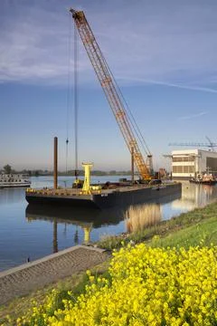 Floating crane in a river Stock Photos