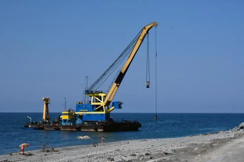 The floating crane on the seacoast 写真素材