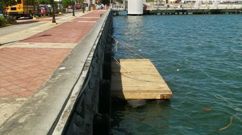 Floating deck on pier side garbage and rubbish on waterfront Stock Footage 8521660