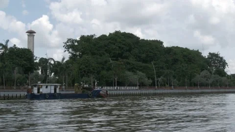 Floating deck POV, trash skimmer boat cleaning up the Martapura river Stock Footage 156994142
