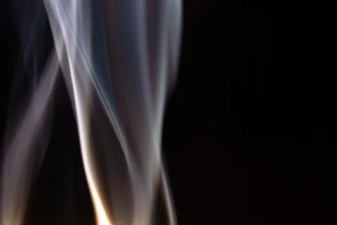 Floating, defocused smoke on a black background Stock Photos
