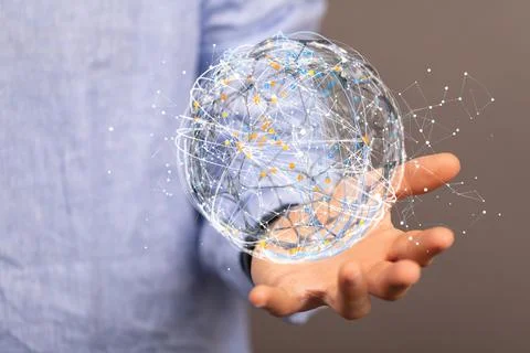 Floating digital 3D circular globe on a man's hand which resembles data network Stock Photos