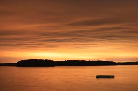 Floating dock in a bay at night. Stock Photos
