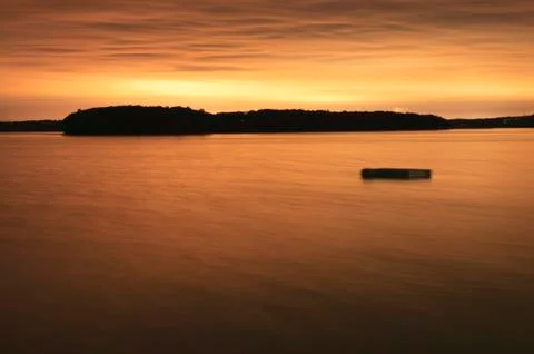 Floating dock in a bay at night. Stock Photos