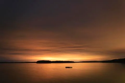 Floating dock in a bay at night. Stock Photos