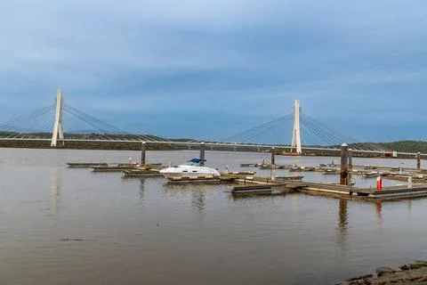 Floating Docks and Cable-Stayed Bridge Across Waterway 写真素材