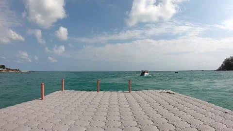 Floating docks made of plastic That moves according to the waves of the sea Stock Footage 131508745