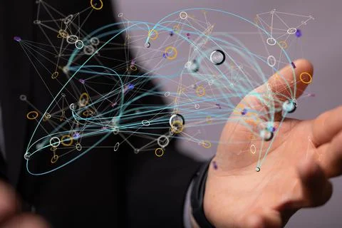 Floating dots with connecting strings above the hand. 写真素材