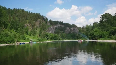 Floating down a river in the mountains. Video stock 133141636