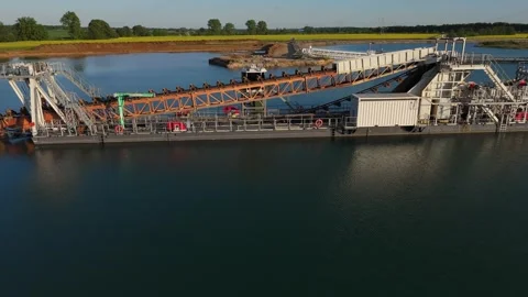 Floating dredger with conveyor system in gravel pit lake near Leipzig, Germany Video stock 309965524