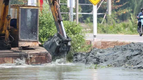 A floating dredger is dredging the bottom of the pond, Thailand Stock Footage 238465247
