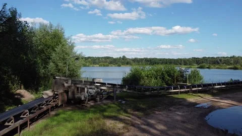 Floating dredgers operating in a flooded sand quarry aerial view industry Stock Footage 211482824