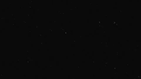 Floating Dust Particles on Black Background Overlay Cinematic Effect Vidéo 330127219