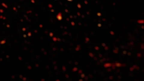 Floating ember particles drift across a black screen, adding a touch of realism Stock Footage 307233796