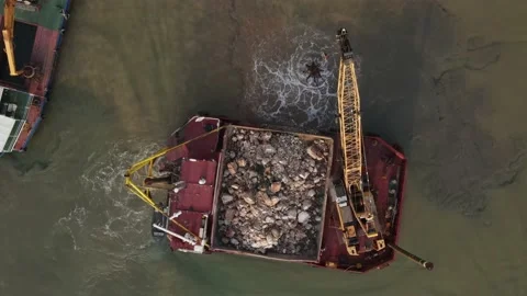 A floating excavator cleans the bottom of the seashore., Croatia, Adriatic Sea 動画素材 238357357