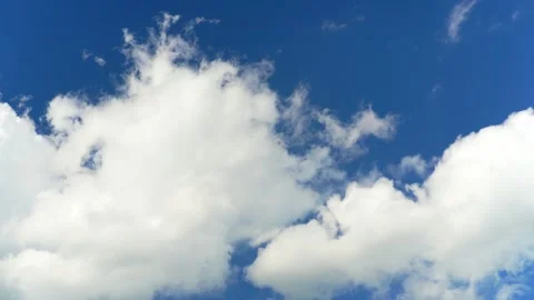 Floating fluffy clouds. Beautiful sunny blue sky with wispy smoky white cumulus Stock Footage 278930661