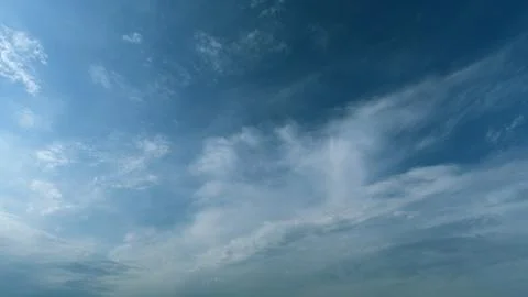 Floating fluffy clouds. Two layers of cloudiness. Blue summer sky with clouds Foto stock