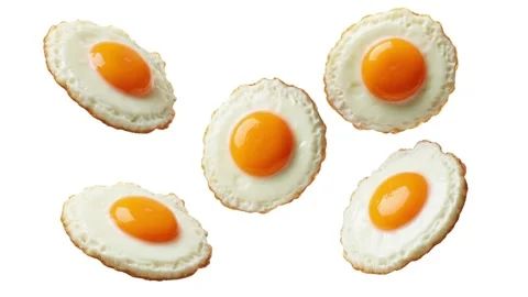 Floating fried eggs isolated on white Stock Footage 339340598