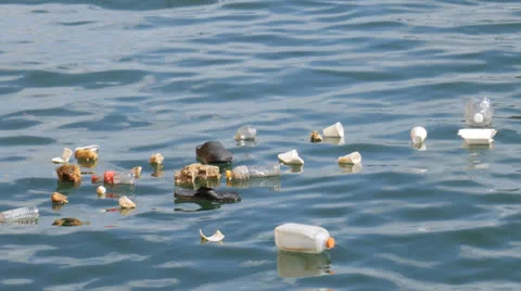 FLOATING GARBAGE - pollution plastic garbage at sea Stock Footage 25846138