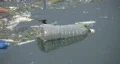 Floating garbage - water bottle. HD Footage