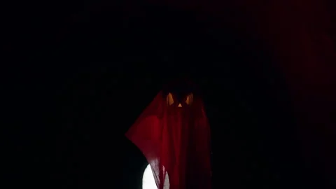 Floating Ghost Shaped Jack O Lantern in Dark Tunnel With Red Light And Bright Ex Stock Footage 337104187