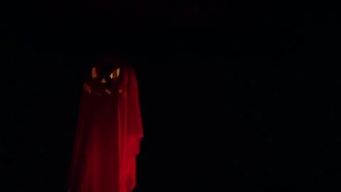 Floating Ghost Shaped Jack O Lantern Hovering in Dark Tunnel, Halloween Supernat Stock Footage 337106483