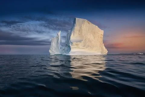 Floating glacier with a human face made of shadows Stock Photos