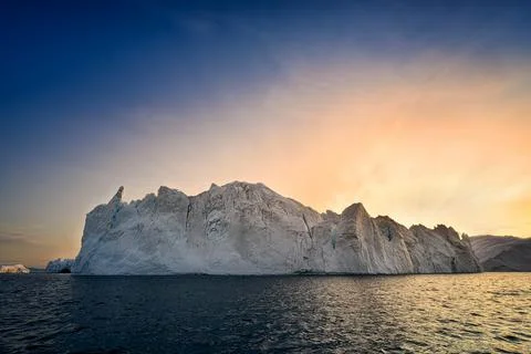 Floating glaciers in the rays of the setting sun during a polar night Stock Photos