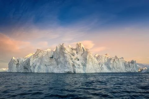 Floating glaciers in the rays of the setting sun during a polar night Stock Photos