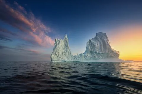 Floating glaciers in the rays of the setting sun during a polar night Stock Photos