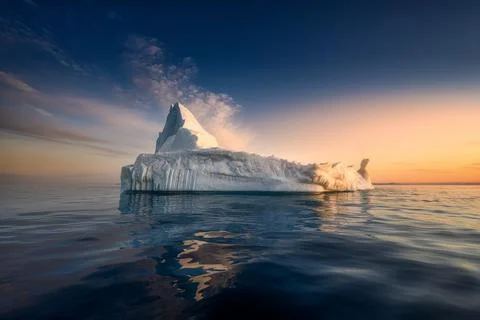 Floating glaciers in the rays of the setting sun during a polar night Stock Photos
