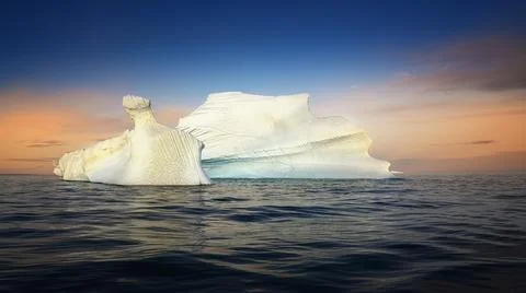 Floating glaciers in the rays of the setting sun during a polar night Stock Photos