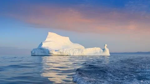 Floating glaciers in the rays of the setting sun during a polar night Stock Photos