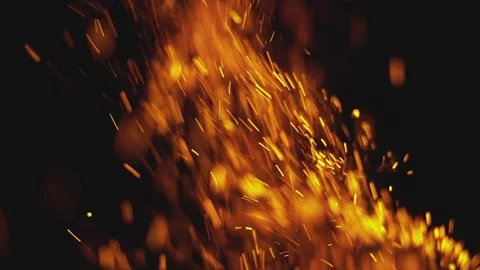 Floating glowing fire embers rising upwards in dark background during night.. Stock Footage 337415684