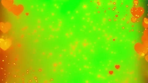 Floating glowing heart particles animated overlay on a vibrant green screen Видео 338995497