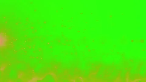 Floating golden dust particles rising against a vibrant green screen background Video stock 339123357