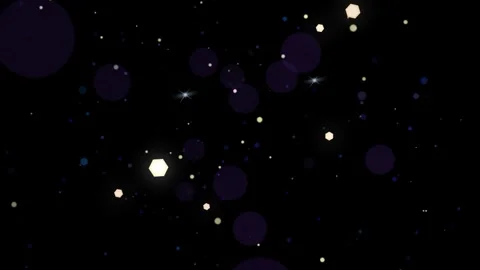 Floating golden particles and glowing star flares against a deep black 库存影片 344218328